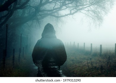 A double exposure of an atmospheric half transparent man looking at a foggy path in the countryside. On a moody foggy winters day.  - Powered by Shutterstock