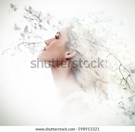 Double exposure of beautiful young woman and dogwood flowers