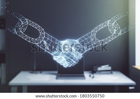 Double exposure of blockchain technology with handshake hologram and modern desktop with laptop on background. Research and development decentralization software concept