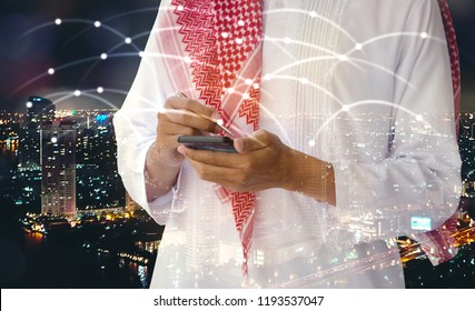 Double Exposure Of Business  Arab Man Ready To Writing On Smart Phone Screen,night City Scape And Network Sign Background,selective Focus.