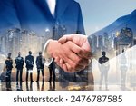 Double exposure of business handshake for successful of investment deal and city night background, teamwork and partnership concept.