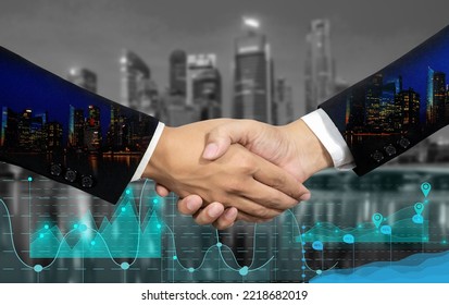 Double Exposure Of Business Handshake For Successful Of Investment Deal And City Night Background, Teamwork And Partnership Concept.Background With Financial Charts Showing Growing Revenue.