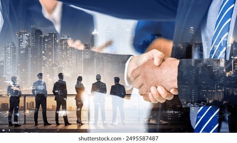 Double exposure of business handshake for successful of investment deal and city night background, teamwork and partnership concept.	