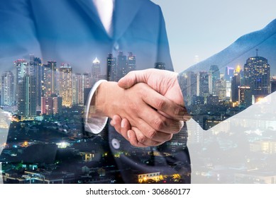 Double exposure of business handshake for successful of investment deal and city night background, teamwork and partnership concept.  - Shutterstock ID 306860177