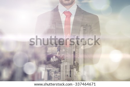 Double exposure with business man and city skyline. Man reflecting himself in the window and watching the skyline from his office