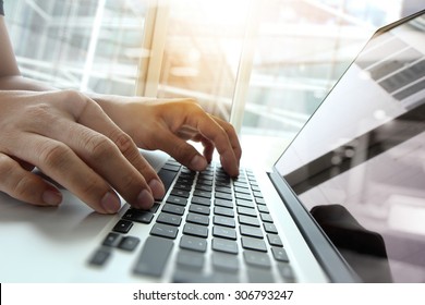 Double Exposure Of Business Man Hand Working On Blank Screen Laptop Computer On Wooden Desk As Concept