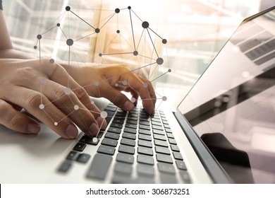Double exposure of business man hand working on blank screen laptop computer on wooden desk as concept with social media diagram   - Shutterstock ID 306873251