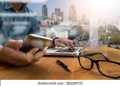 Double Exposure Of Business Man Hand Working On Laptop Computer On Wooden Desk With Social Media Network Diagram