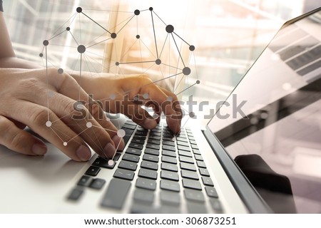 Double exposure of business man hand working on blank screen laptop computer on wooden desk as concept with social media diagram  
