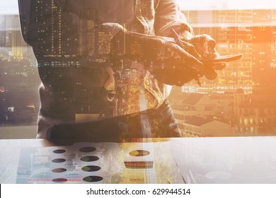 Double Exposure  Business Man With Numerical Analysis With City Background