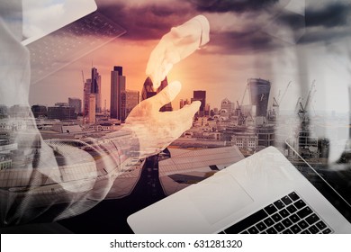 Double exposure of Business partnership meeting concept.photo businessman handshake. Successful businessmen handshaking after perfect deal with city