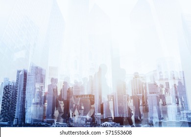 double exposure of business people walking on the street of modern city, urban lifestyle background