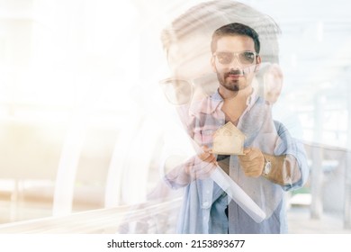 Double Exposure Of Business Success Concept. Mixed Media.Man Hand Holding A Small Wood House.Hand Holding A Wooden Miniature Home