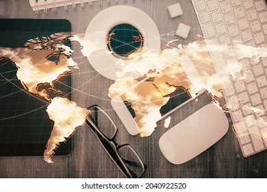 Double Exposure Of Business Theme Hologram Over Desktop With Phone. Top View. Mobile International Trade Connection Concept.