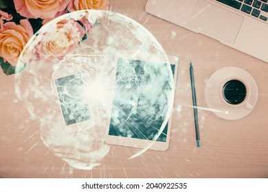 Double Exposure Of Business Theme Hologram Over Desktop With Phone. Top View. Mobile International Trade Connection Concept.