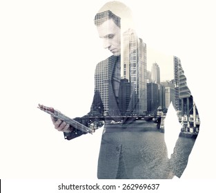 Double exposure of a businessman and a city using a tablet over white background - Shutterstock ID 262969637
