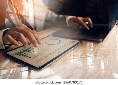 double exposure businessman Couple exposure of businessman and city using tablet and personal computer, cityscape and business organization network concept - Shutterstock ID 2360783175