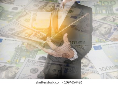 Double exposure of Businessman with currencies - Shutterstock ID 1094654426