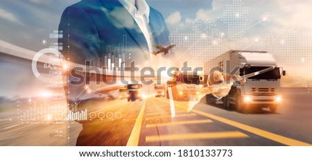 Double exposure of businessman and graph growth of business with world map of transportation and logistics network distribution and trucks of industrial cargo freight for shipping. import-export. 