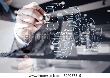 double exposure of businessman hand draws gear to success concept