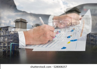 Double Exposure Of Businessman Hand Hold A Pen Write, Review Document And Electric Generating Factory, Power Reactor As Industrial, Energy, Business And Analysis Concept.