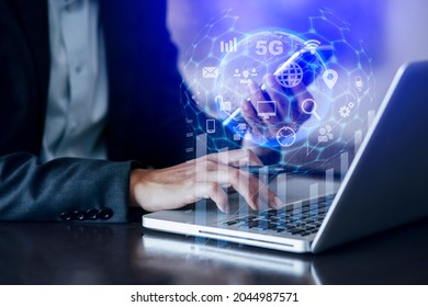 Double exposure of businessman hand touch on tablet with laptop computer and business financial virtual chart, Digital marketing and globe communication concept, blurred background.  - Shutterstock ID 2044987571