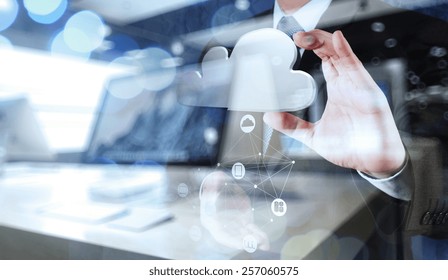 Double Exposure Of Businessman Hand Working With A Cloud Computing Diagram On The New Computer Interface As Concept