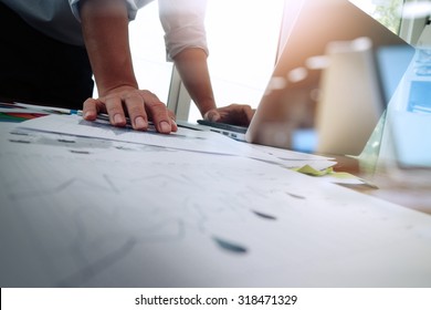Double exposure of businessman hand working with new modern computer and business strategy as concept - Shutterstock ID 318471329