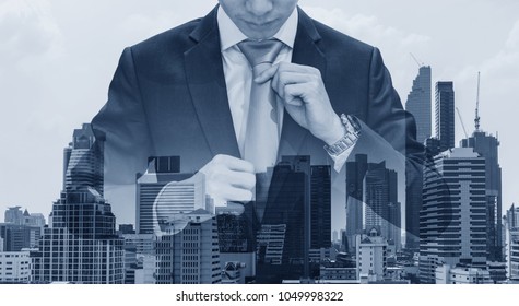 Double exposure businessman holding neck tie with modern buildings in Bangkok city background