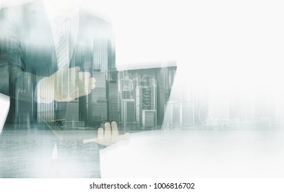 Double exposure of businessman and Hong Kong city view