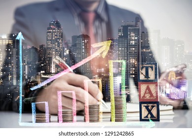 Double exposure of Businessman man and Stack of Coins and colorful growth graph with city night, investing money and tax concept