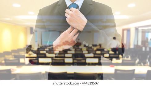 Double exposure businessman rearranging  his neck tie and conference meeting room. Preparing to speak on the stage as a lecturer. Wining his fear and shyness before time.