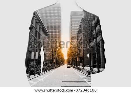 Double exposure of businessman in suit and cityscape. He's looking for his success in business and idea for life