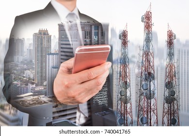 Double Exposure Of Businessman Use Smartphone, Communication Tower Or 4G 5G Network Telephone Cellsite And Foggy Cityscape Urban Background As Business, Technology And Telecom Concept