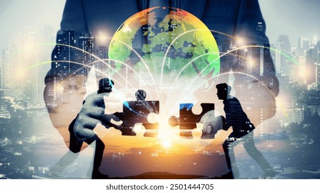 double exposure of businessman using cellphone connecting globe simulation with Silhouette of Two men connect two puzzle pieces with sunset . Concept of business solution, solving a problem. - Powered by Shutterstock