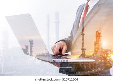 double exposure of businessman using laptop with blur refinery plant background 