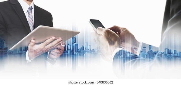 Double exposure businessman using smartphone and digital tablet with city, business communication technology concepts - Powered by Shutterstock