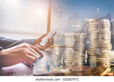 double exposure of businessman working at office with step of golden coins and city night 