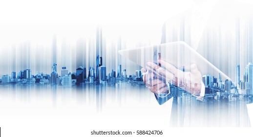 Double Exposure Businessman Working On Digital Tablet With Modern City, Concepts Of Technology Business Development