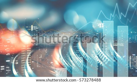 Double exposure of city, graph and rows of coins for finance and business concept
