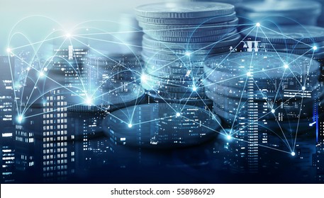 Double exposure of city , network or connection and rows of coins for finance and business concept - Shutterstock ID 558986929