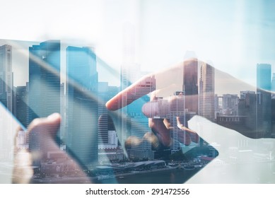 Double Exposure Of City And Tablet