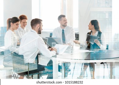 Double exposure of cityscape view and people working at table in office. Concept of financial trading