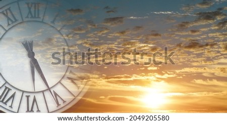 Double exposure of clock face in sunset sky. Time passing concept.