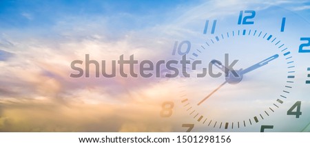 double exposure of cloudy sky and clock at ten o'clock ten minute , time passing concept 