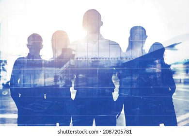 Double exposure of confident male manager standing with his business team in cyberspace background - Shutterstock ID 2087205781