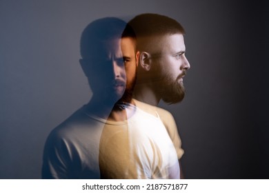 Double exposure crative side view profile and portrait of artistic bearded model man in white t-shirt looking at camera with calm serious face. special blurred beauty effect. indoor studio shot.