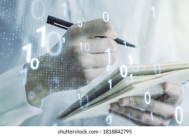 Double exposure of creative abstract binary code hologram and man hand writing in notebook on background. Database and programming concept
