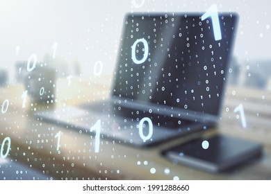 Double exposure of creative abstract binary code hologram and modern desktop with laptop on background. Database and programming concept