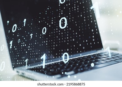 Double exposure of creative abstract binary code hologram on laptop background. Database and programming concept